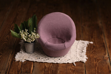 Newborn photography backdrop digital props. Armchair decorated with flowers on a wooden background.