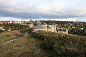 Beautiful view of the old fortress against the background of the modern city