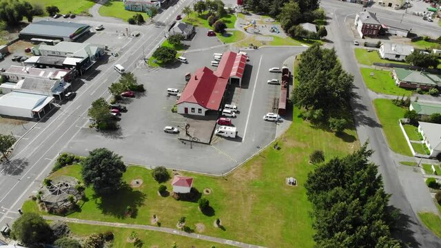 Aerial pull back from Lumsden information centre, reveal of housing area, New Zealand