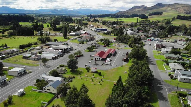 Aerial tilt down to Lumsden free campsite, old train station rebuilt to a tourist spot, New Zealand