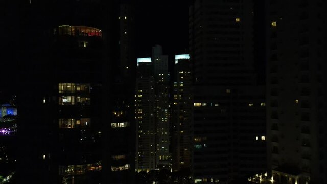 Panoramic aerial drone view of Buenos Aires city downtown at night over skyscraper buildings. Puerto Madero.