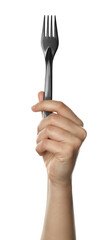 Woman holding plastic fork on white background, closeup