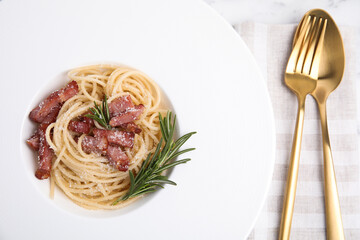 Delicious Carbonara pasta on table, flat lay