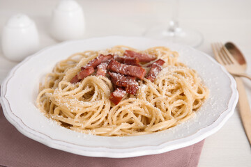 Delicious Carbonara pasta on white table, closeup