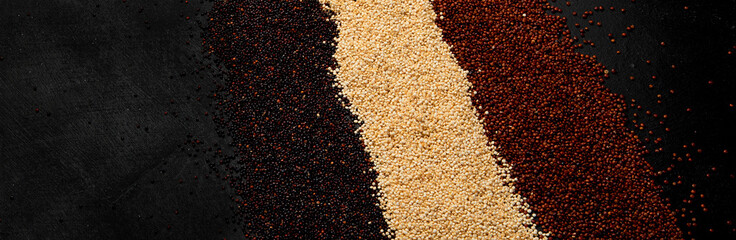 Set with different types of quinoa on dark background. Organic food concept.