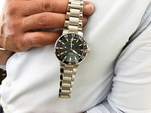 Alicante, Spain- April, 2021: Swiss made professional diver Oris Aquis watch Whale shark limited edition in man hands