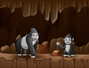 Cartoon a gorilla with her cub in the cave © dreamblack46