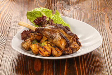 Baked lamb leg with vegetables