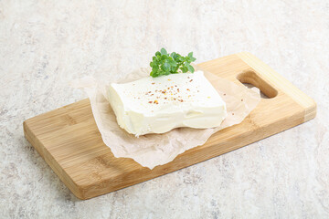 Greek Feta cheese over board
