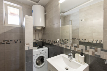 Bathroom interior with tiled walls