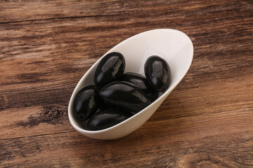Pickled black olives in the bowl