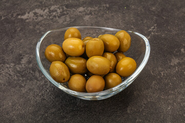 Green pickled olives in the bowl