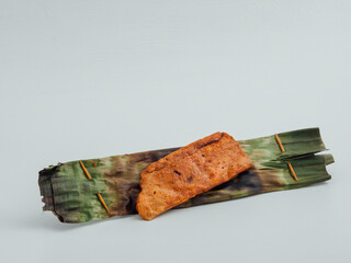 Otah asian barbequed spicy fish paste in banana leaf