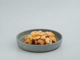 Stir fried prawns shrimps asian style in a grey dish