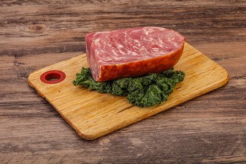 Beef ham piece over board