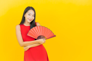 Portrait beautiful young asian woman with chinese fan