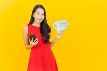 Portrait beautiful young asian woman smile with a lot of cash and money