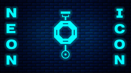 Glowing neon Chinese paper lantern icon isolated on brick wall background. Vector