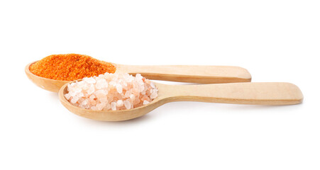 Spoons with different salt on white background