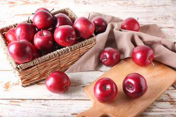 Fresh red apples on table