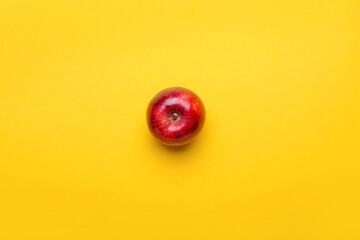 Fresh red apple on color background