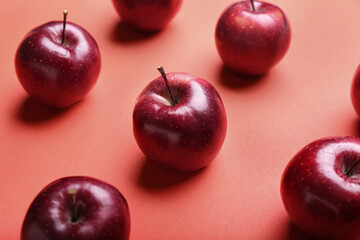 Fresh red apples on color background