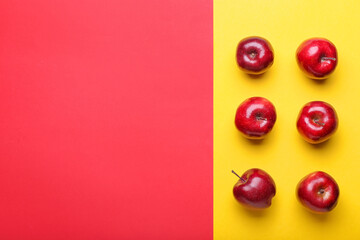 Fresh red apples on color background