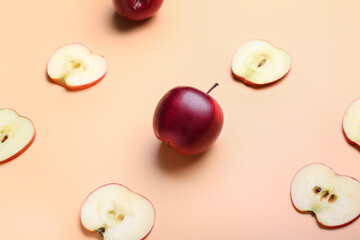 Fresh red apple with slices on color background