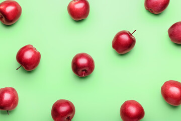 Naklejka na ściany i meble Fresh red apples on color background