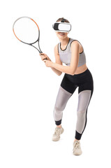 Sporty young woman with virtual reality glasses playing tennis on white background