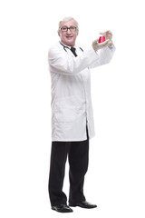 full-length. mature doctor with a laboratory flask in his hands .