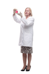 in full growth. smiling medical woman with a laboratory flask.