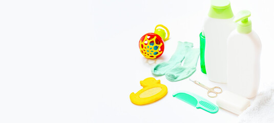 Baby care products on a white background. Daily baby care products for skin care, for bathing. Hygiene of the newborn.