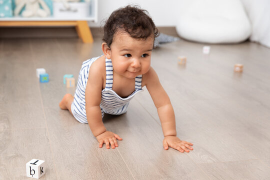 Baby Crawling On Playroom Floor