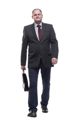 in full growth. confident business man giving a thumbs up.