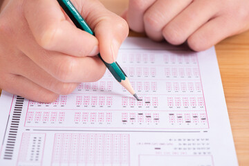 Pencil drawing selected choice on answer sheets