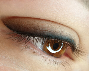 eye with makeup close up made arrow with shading permanent tattooing