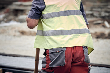 Construction worker working on a public site reconstruction.