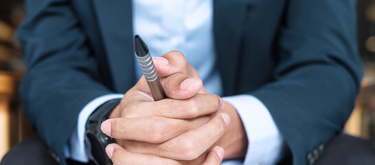 Businessman in suit at office or cafe, hand of man holding during something thinking. business, decision and vision concepts