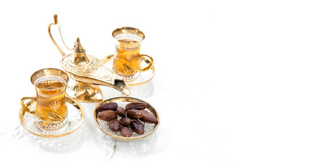 Oriental hospitality. Ramadan kareem. Tea table golden lantern decoration
