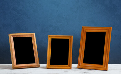 frames on table, blue wall