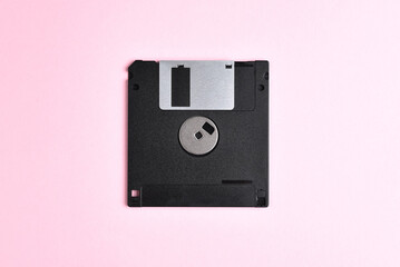 Floppy disk on pink background