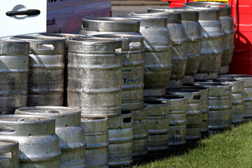 Alloy beer kegs outside a public house.