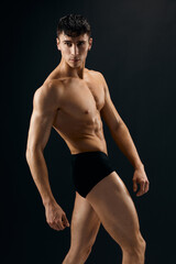 Naklejka premium handsome man muscular naked torso posing in studio