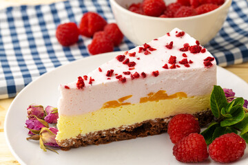 Piece of cheesecake with strawberry on plate