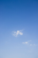 White cloud in blue sky. Clear blue day.