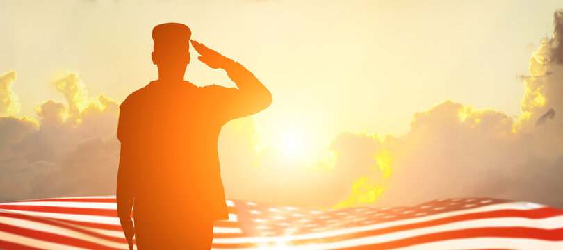 Soldier and USA flag on sunrise background .Concept National holidays , Flag Day, Veterans Day, Memorial Day, Independence Day, Patriot Day.