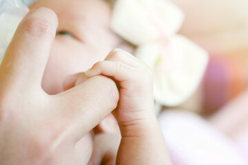 Mother raised her daughter, mother feeds the baby with breast milk, and the newborn baby is bottle-fed.