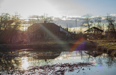 old abandoned lake in the village and sunset