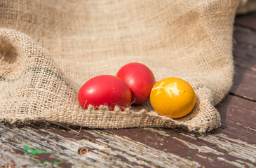 Easter eggs on wooden background.  Easter decorations with colored eggs